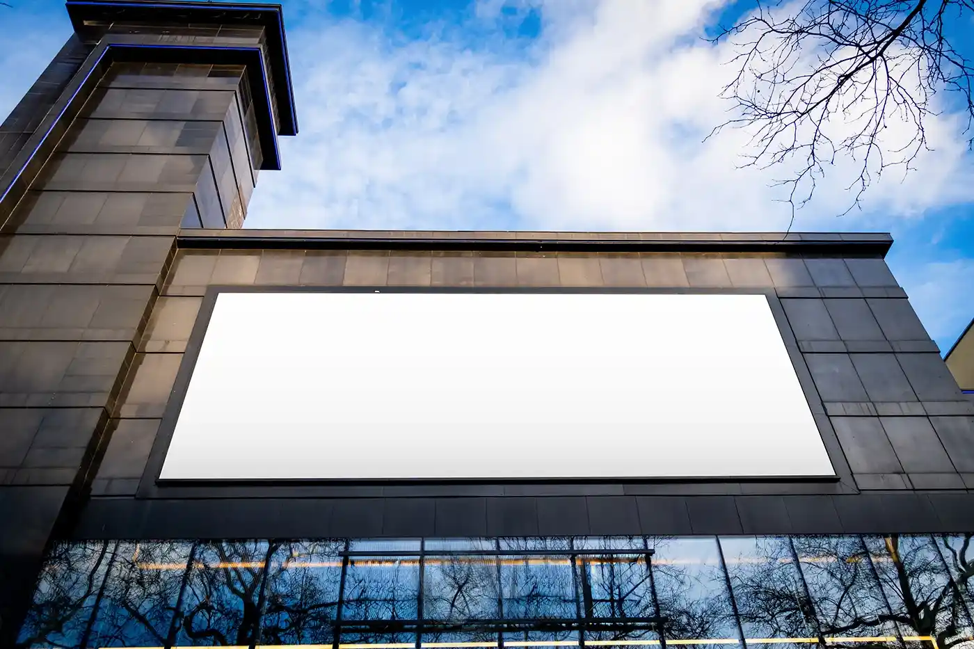 Free-Billboard-on-Black-Building-Mockup-PSD.webp
