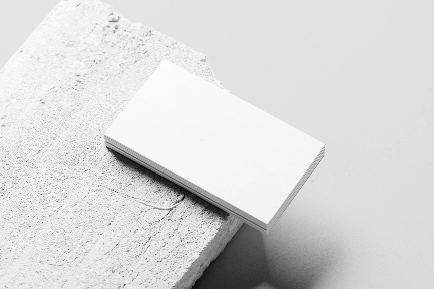 Free-Visiting-Card-Mockup-On-a-Concrete.webp